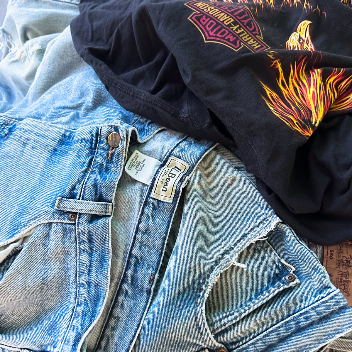 Current vintage drop with graphic tees and denim styled together showing faded prints and everyday wear